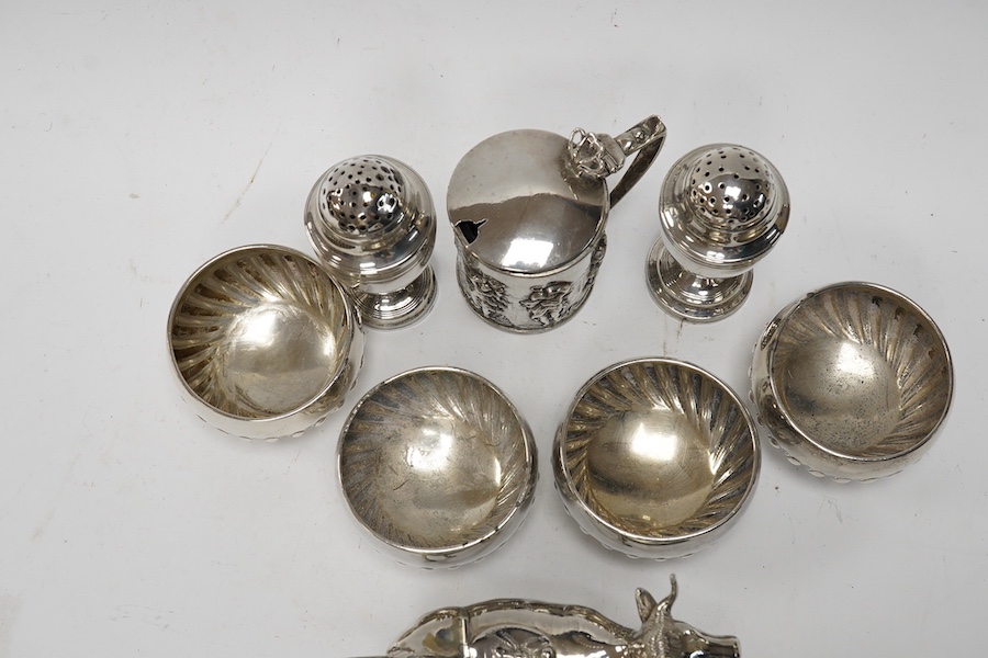 Assorted small silver including a cigarette case, set of four Victorian salts by Thomas Bradbury & Sons, London, 1878, a sterling cow creamer and three condiments. Condition - fair to good